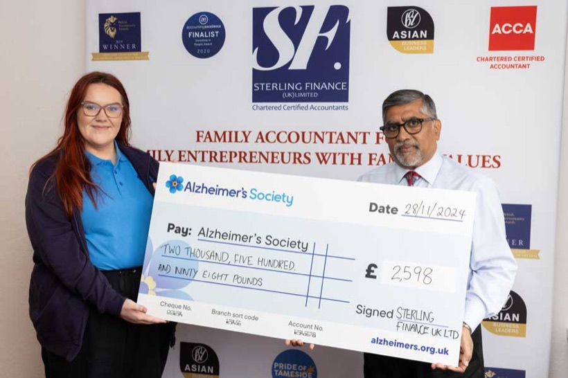 Sterling Finance presenting a charity cheque